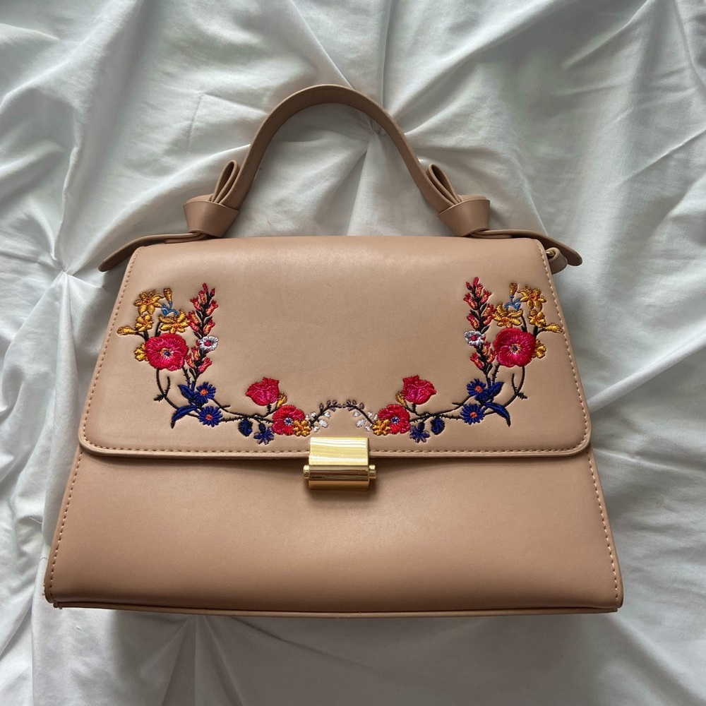 Tan “a new day” bag with flower embroidery and detachable longer strap
